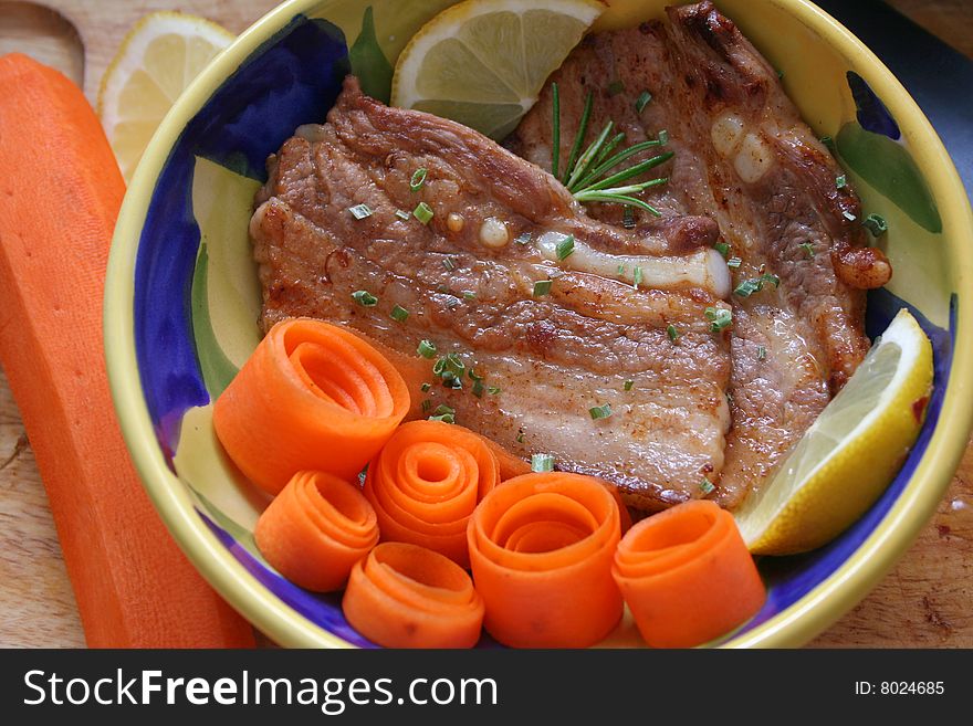 Fresh meat of pork with carrot-salad. Fresh meat of pork with carrot-salad