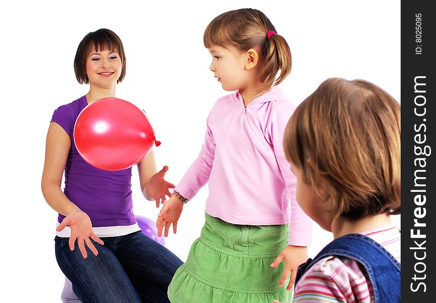 Mother and his two daughters with colorful balloons. studio shoot over white background