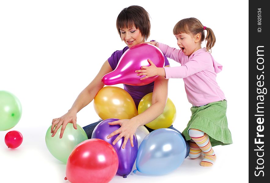 Mother and his daughter with colorful balloons. studio shoot over white background