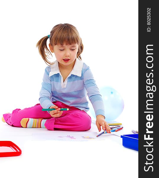 Young girl painting a picture on paper. Young girl painting a picture on paper