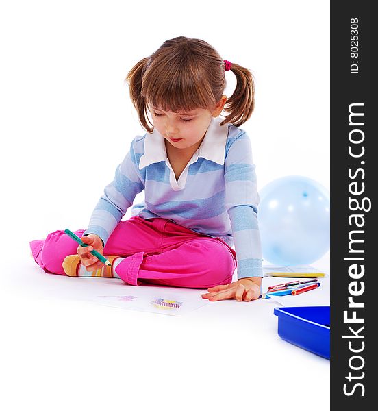 Young girl painting a picture on paper. Young girl painting a picture on paper