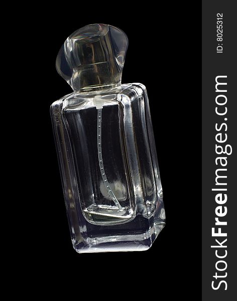 Glass vial with perfumes on black background