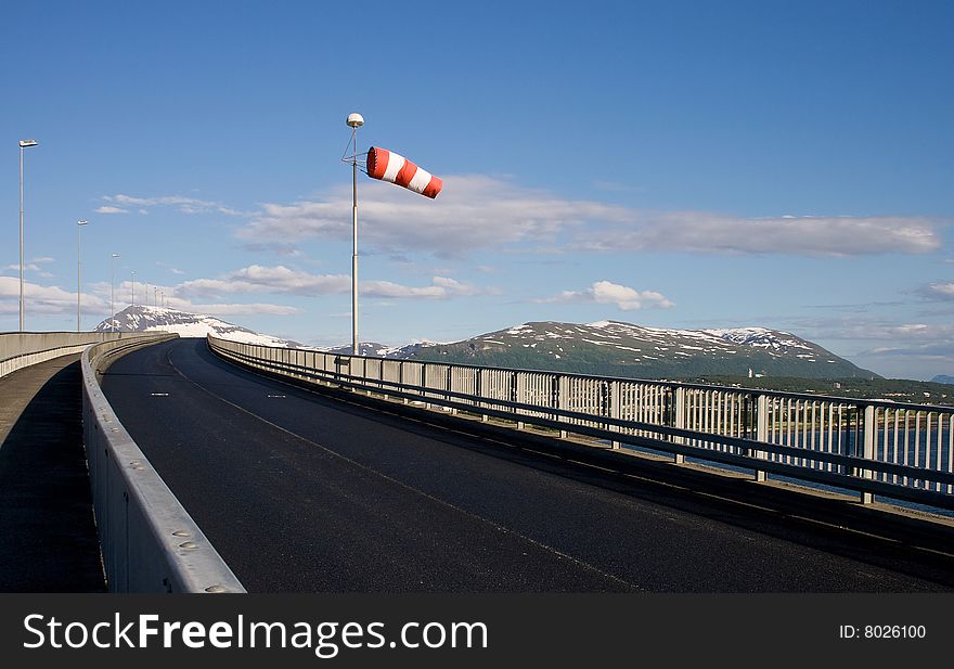 Bridge road and striped windsock in Tromso, Norway