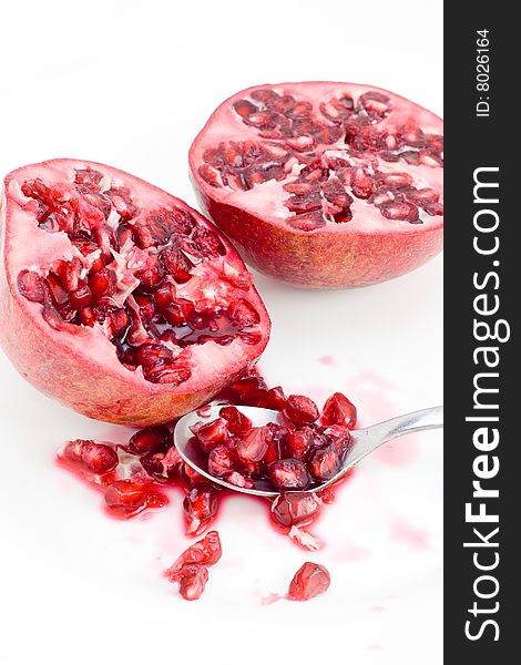 Pomegranate seeds and spoon