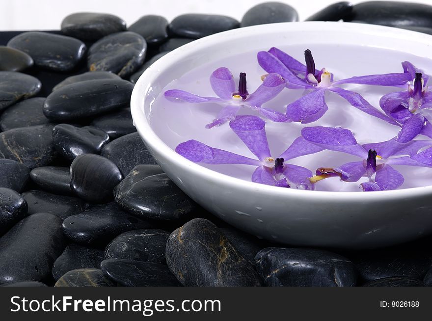 Stacked zen stones with flower. Stacked zen stones with flower