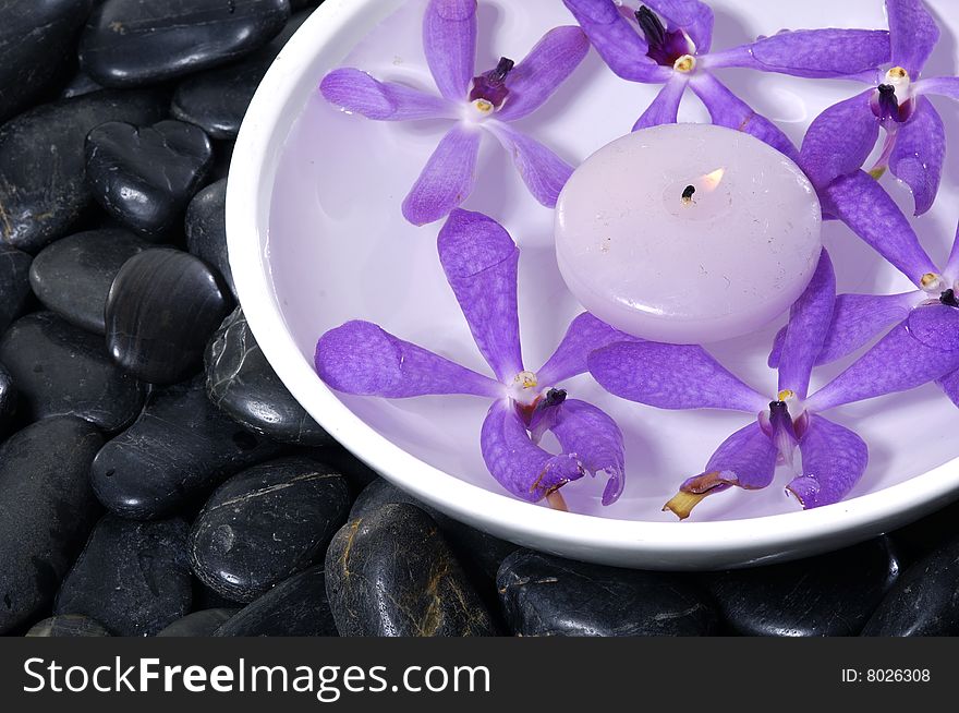 Stacked zen stones with flower. Stacked zen stones with flower