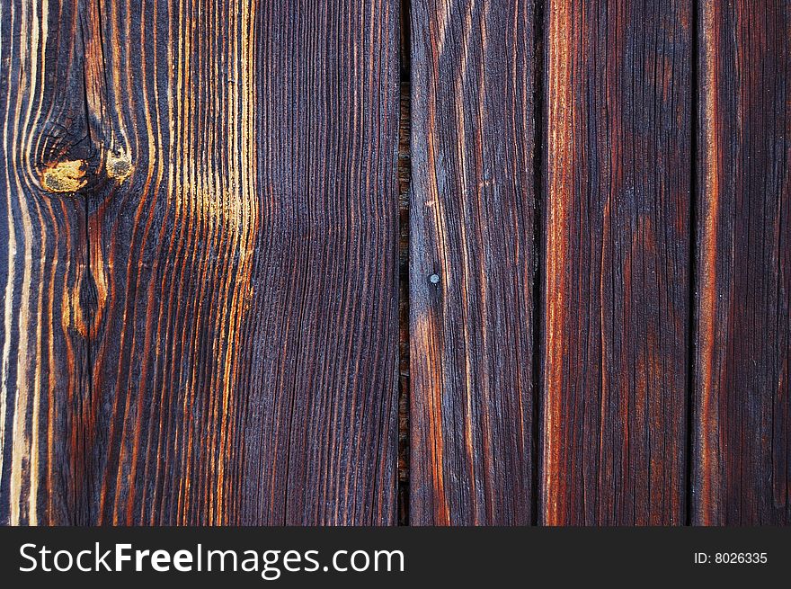 Old burnt wooden boarding texture. Old burnt wooden boarding texture