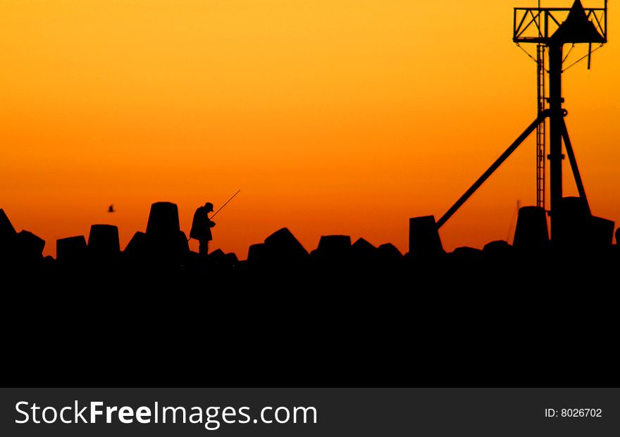 Fisherman On Jetty