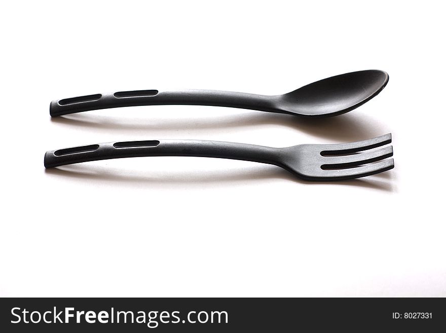 Spoon and fork for cookware coated with Teflon