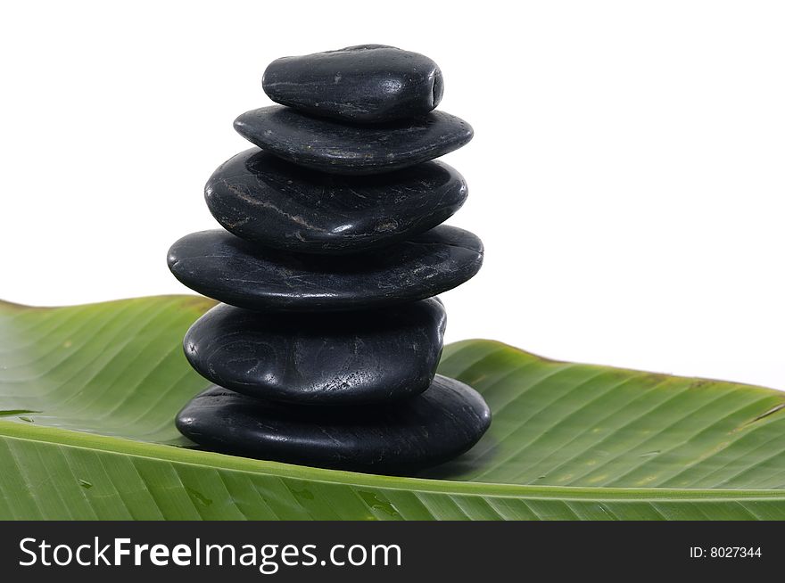 Black Stones on banana leaf. Black Stones on banana leaf