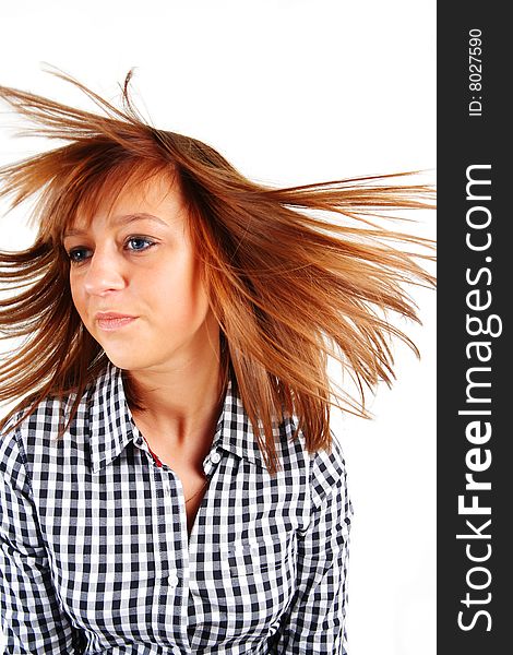 Pretty young woman flinging long hair into air isolated