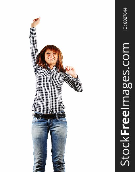 Young female jumping while listening to music isolated
