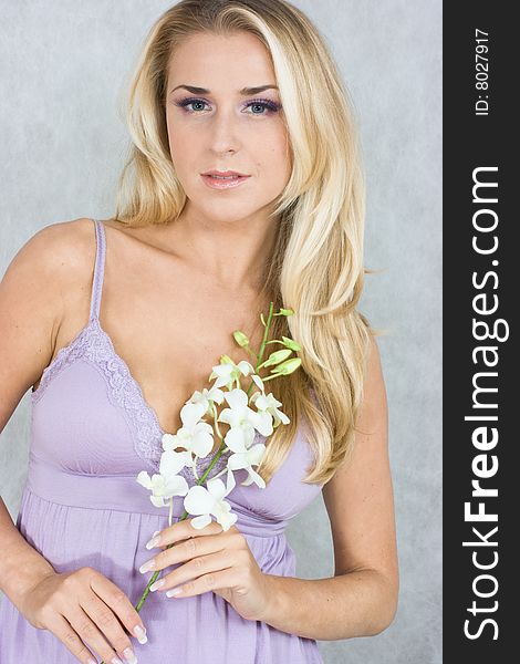 Blond girl with flower