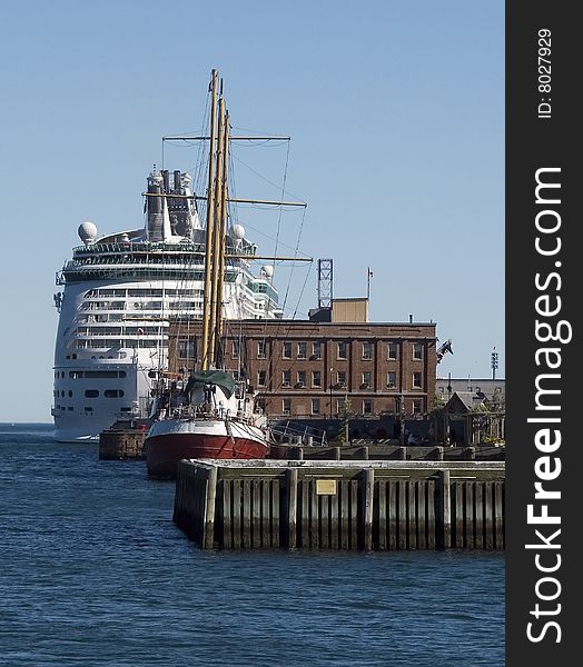 Docking of both an older sailing vessel and new cruise ship. Docking of both an older sailing vessel and new cruise ship.
