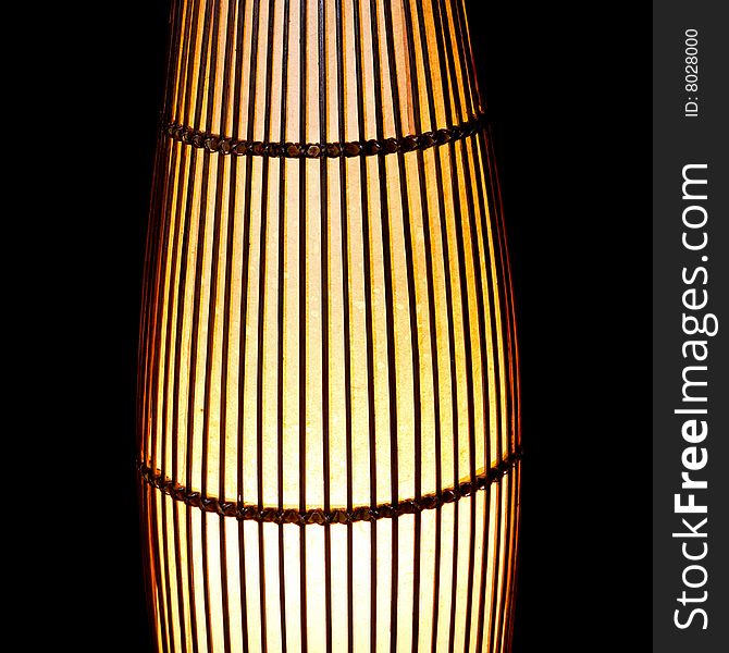 Home lamp made from rattan plait isolated. Home lamp made from rattan plait isolated