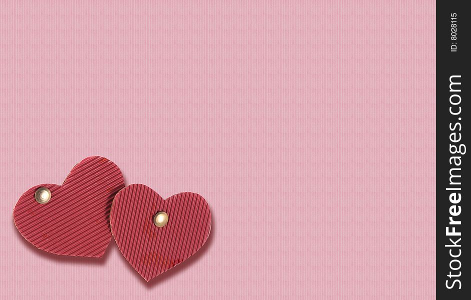 Two cardboard hearts of red color on a pink background. Two cardboard hearts of red color on a pink background.