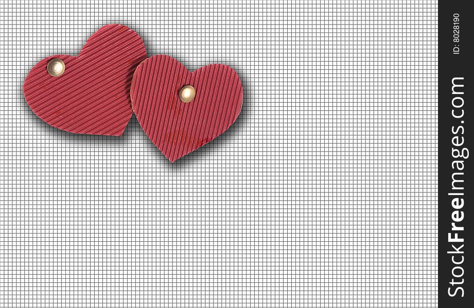Two cardboard hearts of red color on background in a cell. Two cardboard hearts of red color on background in a cell.