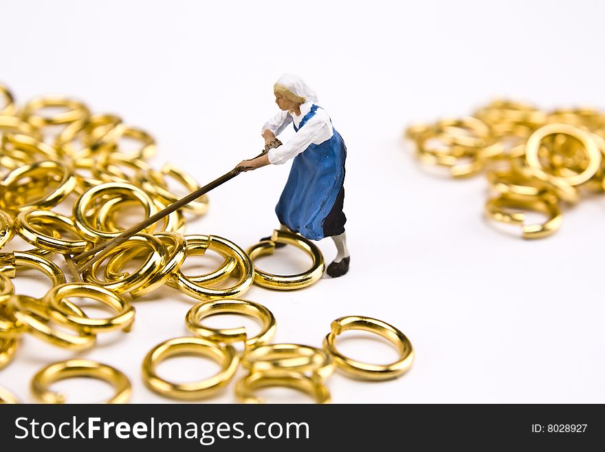 Miniature working woman ranking in gold rings. Miniature working woman ranking in gold rings.