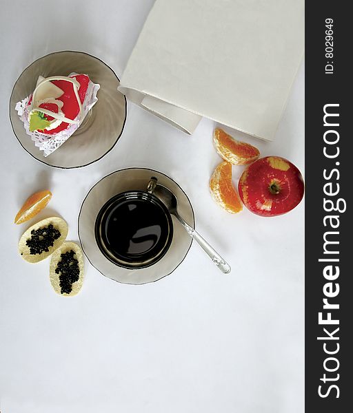 Table with cup coffee, fruits
