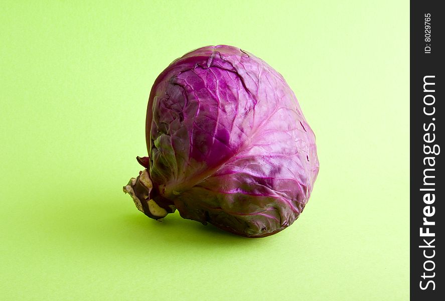 Cabbage close-up isolated on a green background