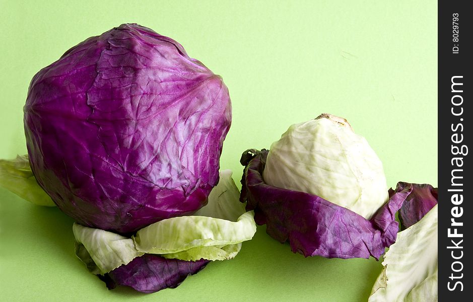 Cabbage close-up isolated on a green background