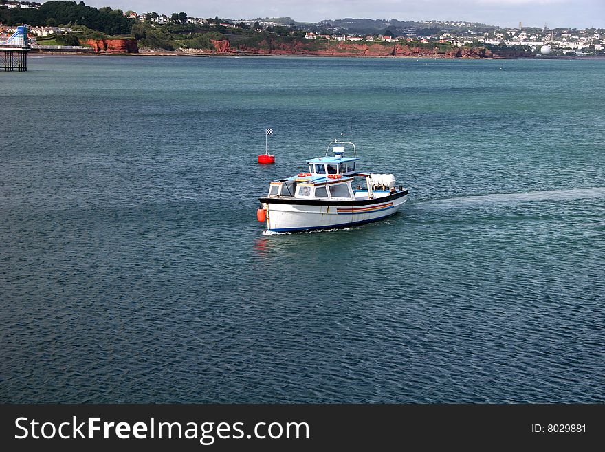 Fishing boat sailing across Torbay