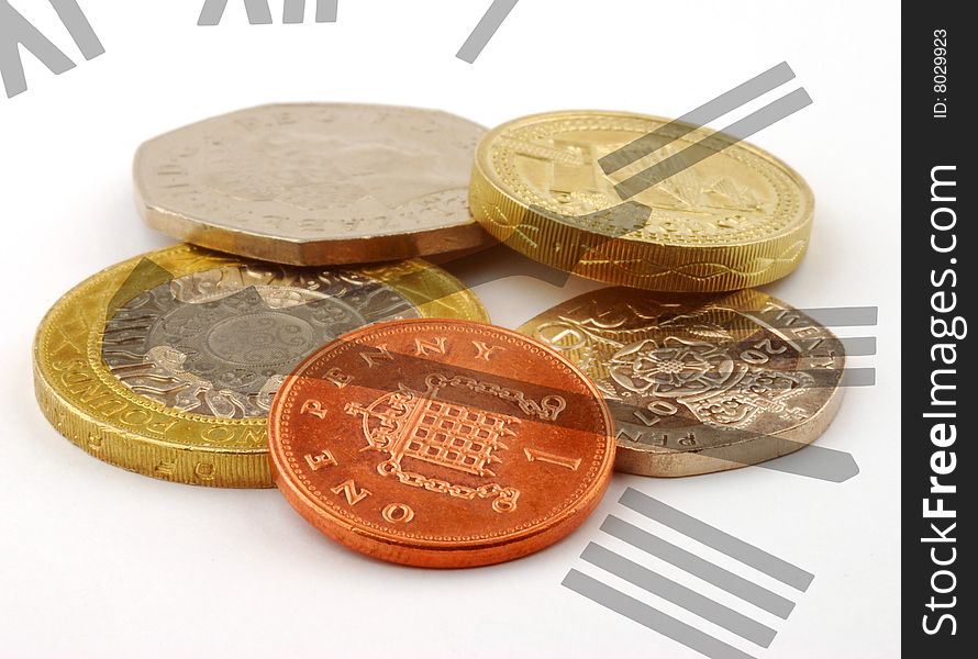 Clock face overlaid over pile of UK coins. Clock face overlaid over pile of UK coins
