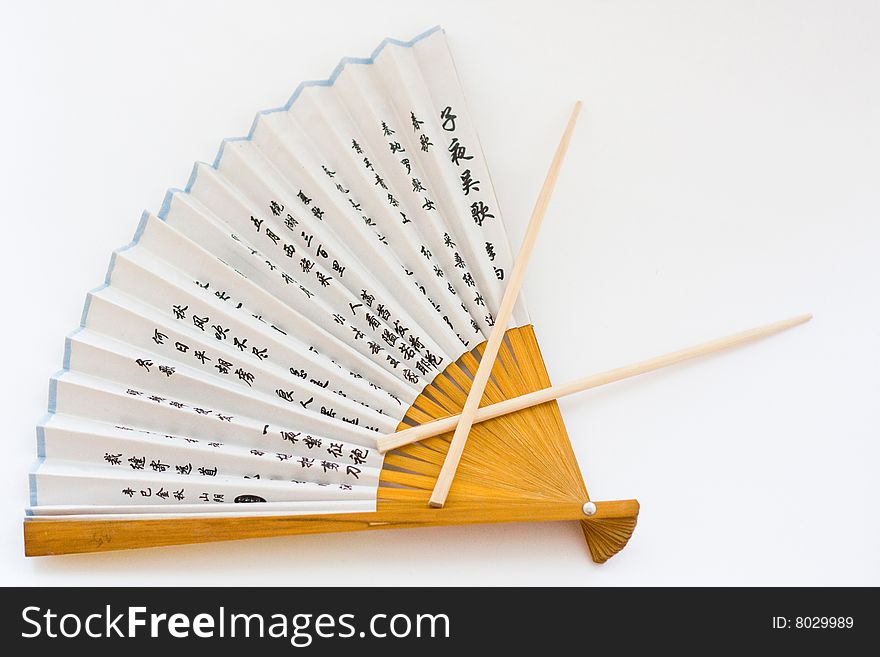 Fan and Chopsticks on the white background