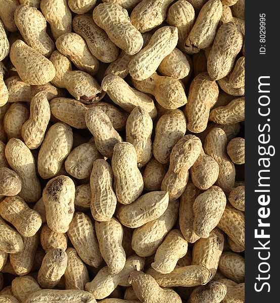 Brown dry roasted peanuts background