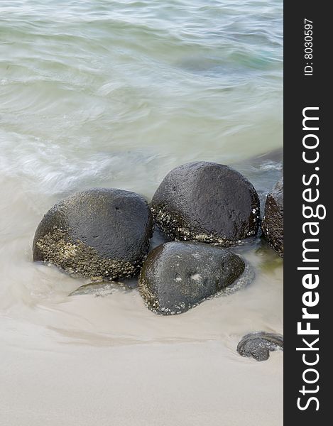 Rocks on a seashore exposed by the ebbing tide. Rocks on a seashore exposed by the ebbing tide.