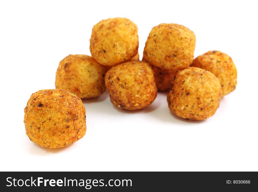 Close up of many snack balls over white background.