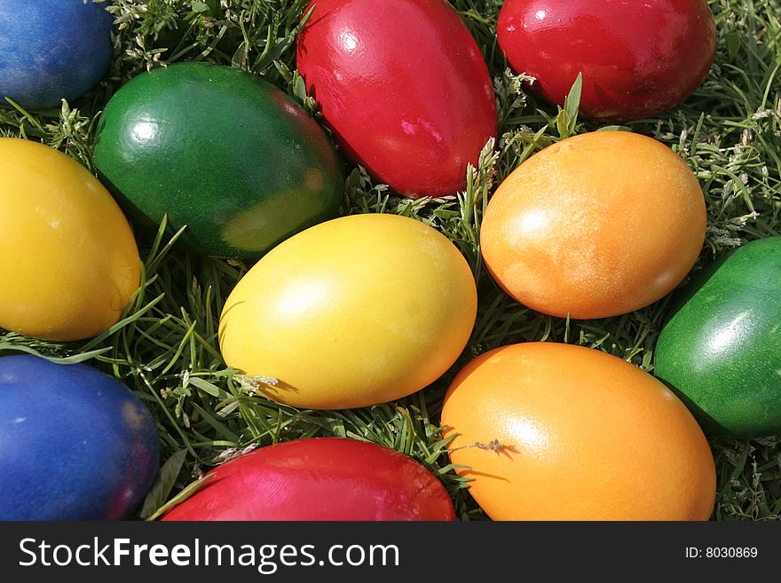 Easter eggs with different color on the grass