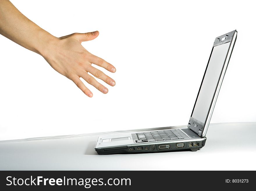 Hand pointing to the computer. Isolated over white background