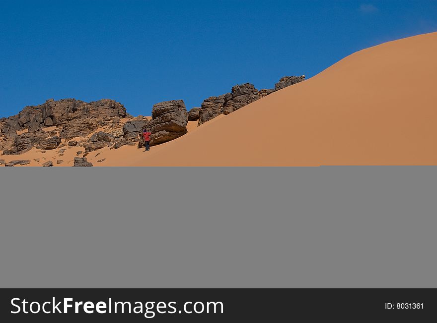 Dune And Rock In Blue Sky Desert