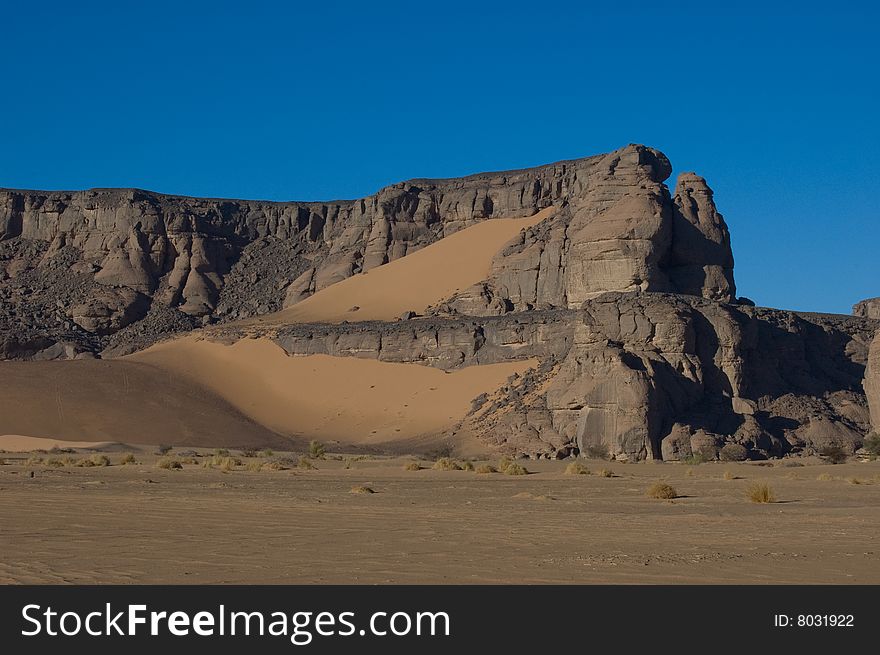 Black rock in desert and sky. Black rock in desert and sky