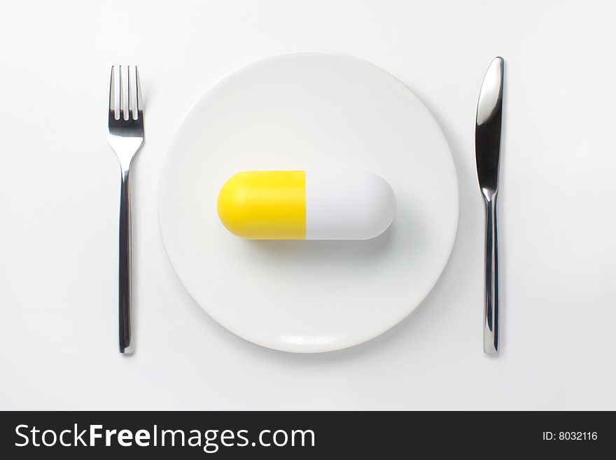 Vitamin on the white plate. Vitamin on the white plate