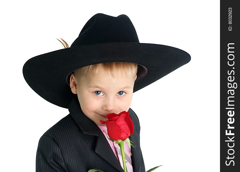 Little boy smelling a rose closeup portrait. Little boy smelling a rose closeup portrait