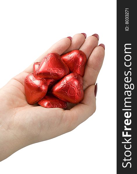 Woman hand holding red hearts