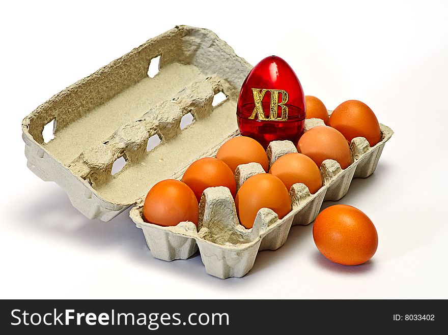 Easter eggs in carton box on white