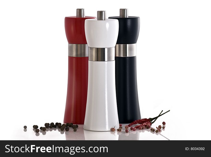 Large polished wooden, pepper/salt mill with chilli on white background. Large polished wooden, pepper/salt mill with chilli on white background