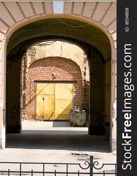 Gateway, courtyard and brick wall with door. Gateway, courtyard and brick wall with door