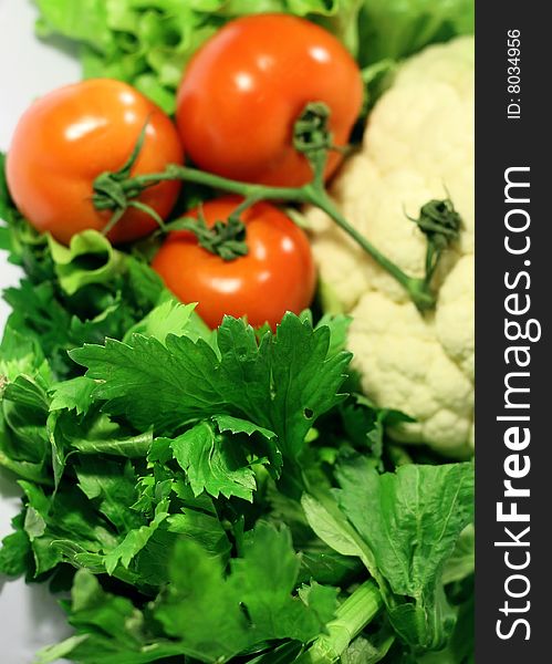 Fresh assorted vegetables: tomatos, celery and cauliflower. Fresh assorted vegetables: tomatos, celery and cauliflower