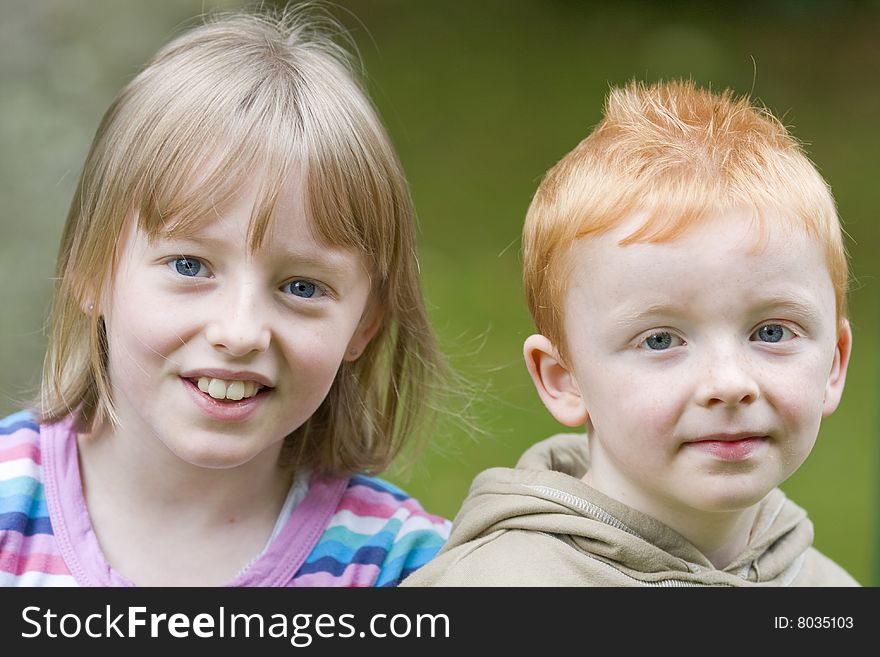 Brother and sister siblings mile for the camera. Brother and sister siblings mile for the camera