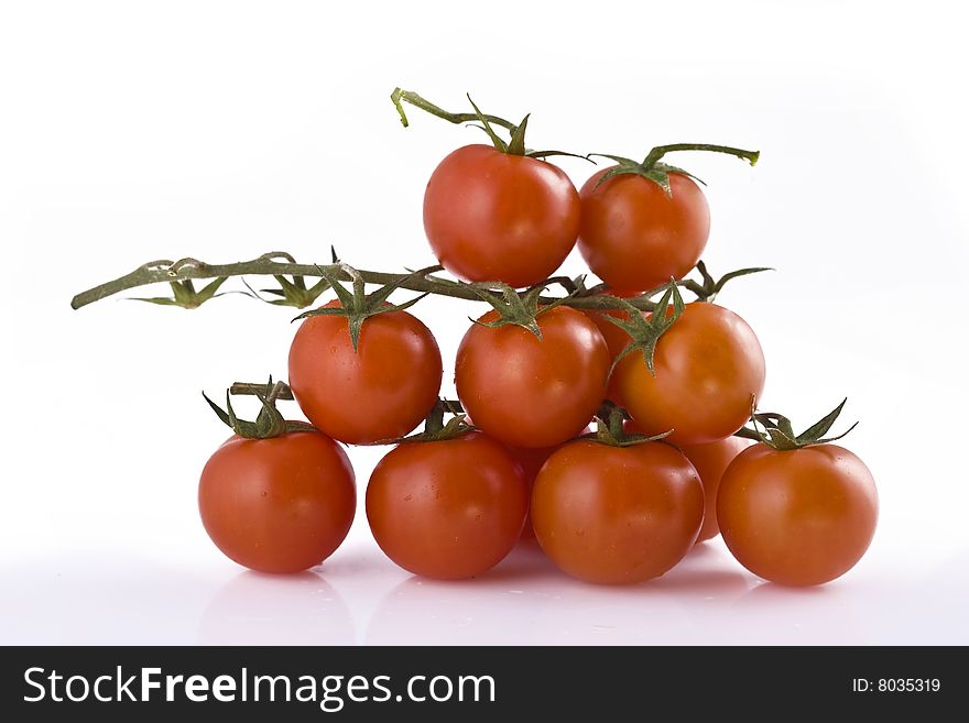 Branch of fresh tomato isolated on white