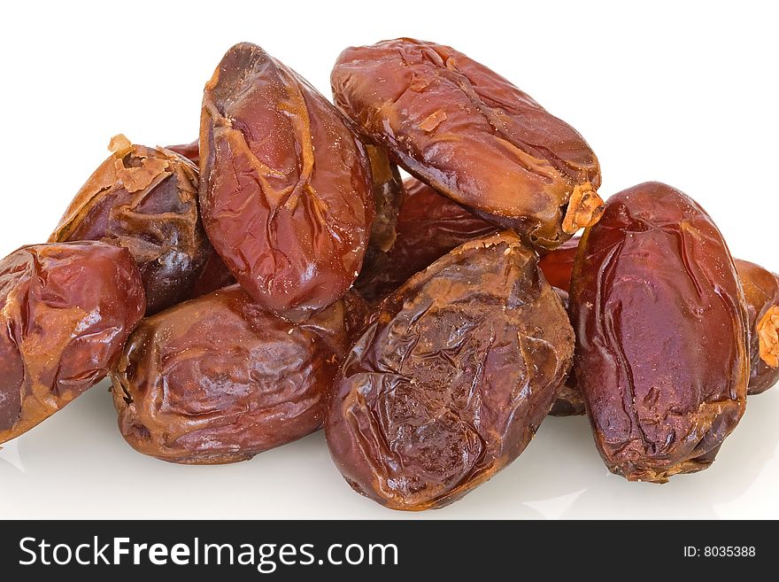 Close-up of dried dates against a white background