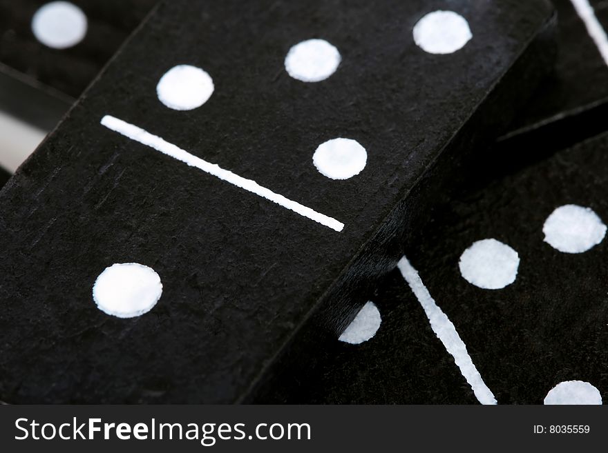 Close up of dominoes, black with white dots