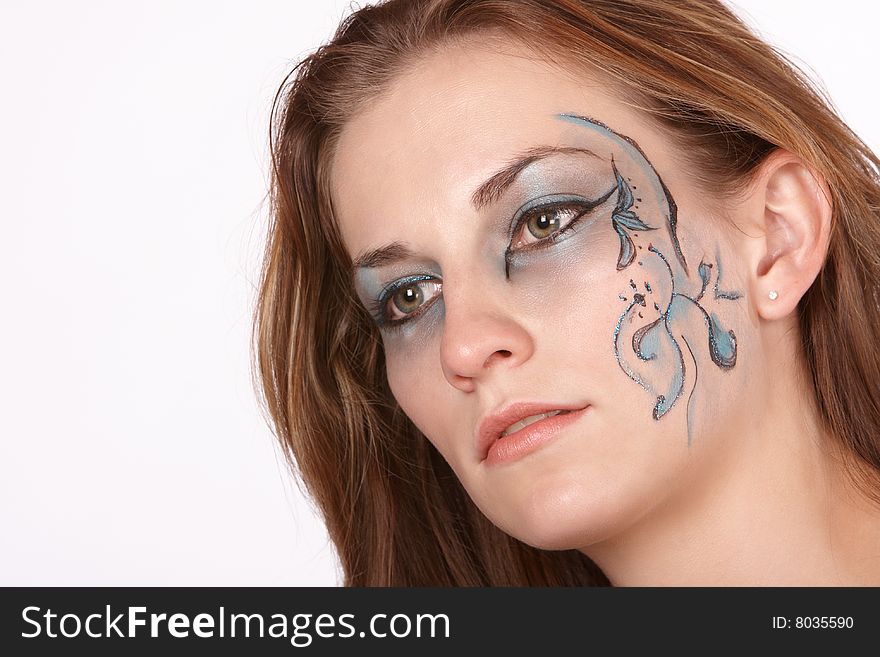 Dreamy far off expression in fantacy makeup model with long brown hair