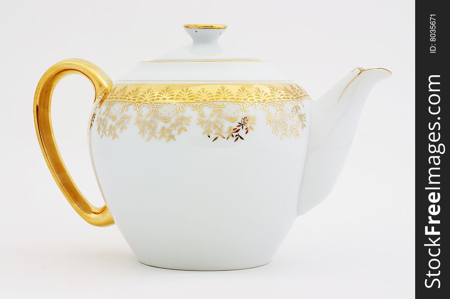Ornate gold decorated teapot for serving fine teas. Ornate gold decorated teapot for serving fine teas.