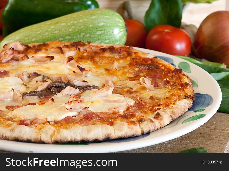 Delicious pizza with cheese and ham on decorated platter