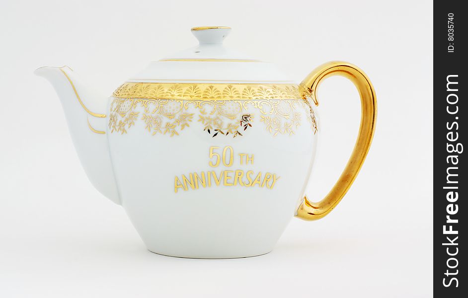 Ornate gold decorated teapot for celebrating a half century together. Ornate gold decorated teapot for celebrating a half century together.